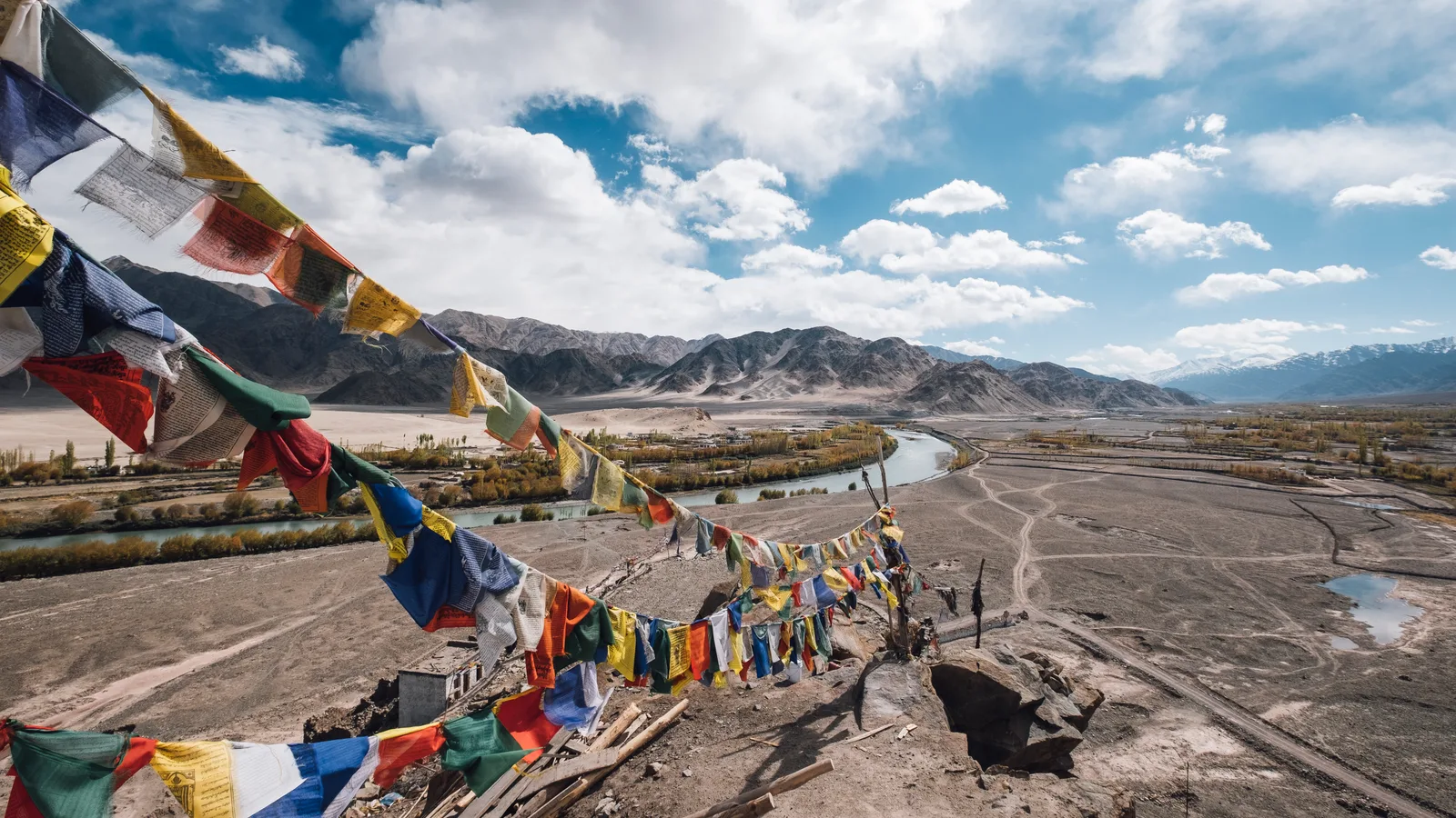 Prayer flags in high mountain terrain for Kailash pilgrimage planning